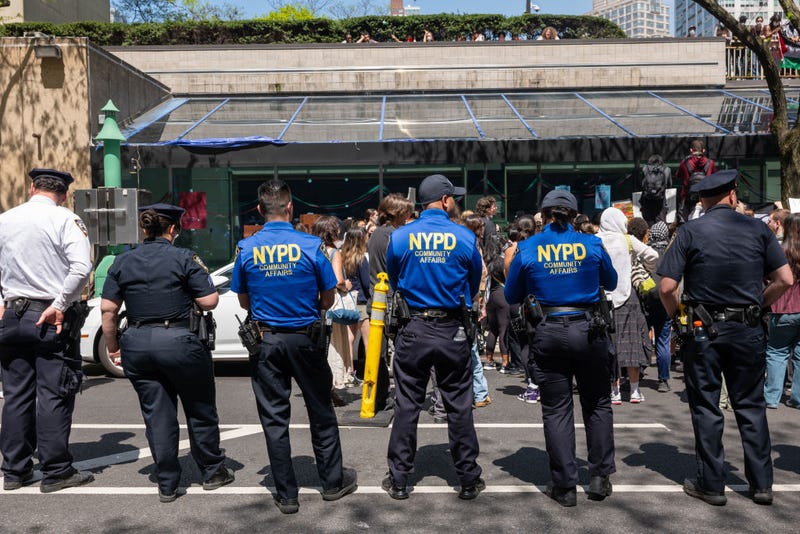 Pro-Palestinian protesters gather outside Fordham's Lincoln Center campus after a group created an encampment inside the building on May 1, 2024.