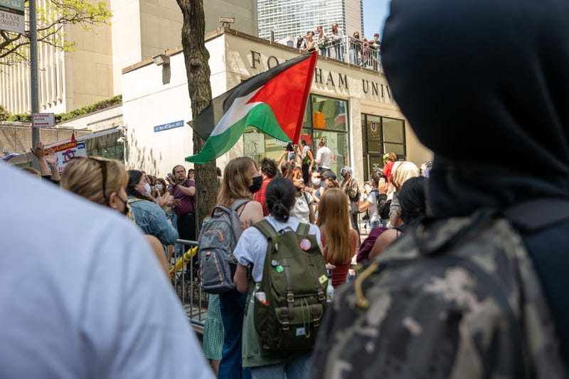 Pro-Palestinian protesters gather outside Fordham's Lincoln Center campus after a group created an encampment inside the building on May 1, 2024.