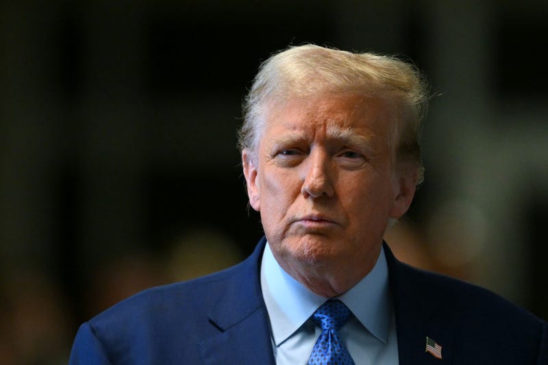 Former U.S. President Donald Trump speaks to the media as he attends his trial for allegedly covering up hush money payments at Manhattan Criminal Court on May 9, 2024 in New York City.