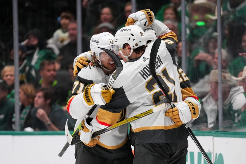 Brett Howden #21 of the Vegas Golden Knights celebrates with William Karlsson #71 and Michael Amadio #22 after scoring a goal against Jake Oettinger #29 of the Dallas Stars