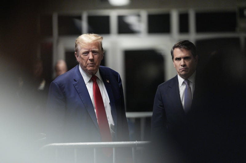 Former U.S. President Donald Trump, with attorney Todd Blanche (R), speaks to the press as he arrives for his criminal trial for allegedly covering up hush money payments at Manhattan Criminal Court on May 10, 2024 in New York City. Trump was charged with 34 counts of falsifying business records last year, which prosecutors say was an effort to hide a potential sex scandal, both before and after the 2016 presidential election. Trump is the first former U.S. president to face trial on criminal charges.