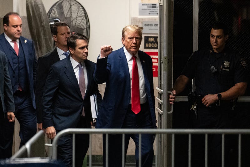 Former U.S. President Donald Trump raises his fist as he and attorney Todd Blanche return after a break in the day's proceedings in his trial for allegedly covering up hush money payments at Manhattan Criminal Court on May 10, 2024 in New York City.