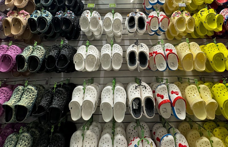 Crocs shoes are displayed in a Crocs store