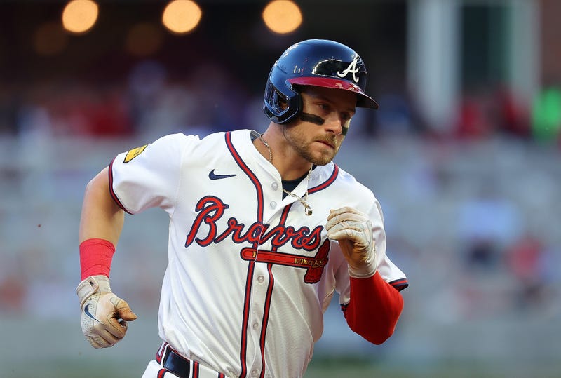 Jarred Kelenic #24 of the Atlanta Braves rounds third base after hitting a two-run homer in the third inning against the Boston Red Sox at Truist Park
