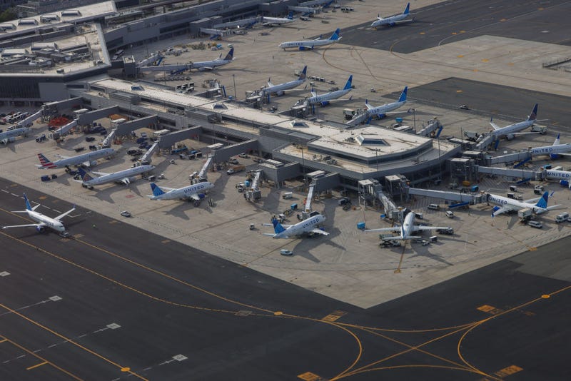 Aerial view of United Airlines passenger planes docked in a terminal of Newark Airport in Newark, New Jersey, on May 11, 2024.