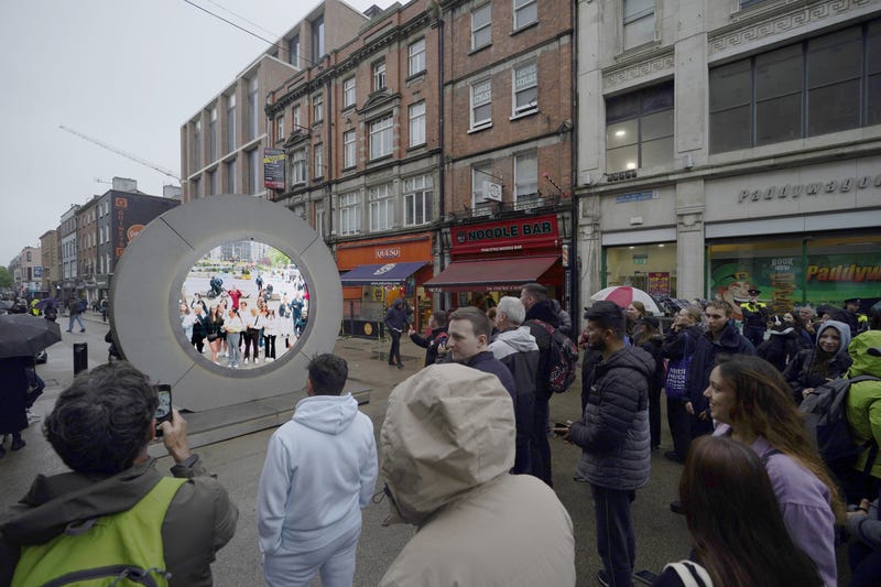 People in Dublin view the Portal to New York on May 13, 2024