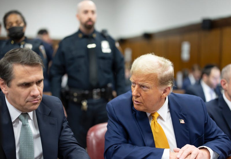 Former U.S. President Donald Trump appears in court with his attorneys Todd Blanche (L) and Emil Bove during his trial for allegedly covering up hush money payments at Manhattan Criminal Court on May 14, 2024 in New York City.
