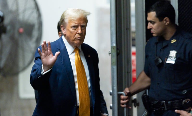 Former US President Donald Trump returns to the courtroom after a break in his trial for allegedly covering up hush money payments at Manhattan Criminal Court on May 14, 2024 in New York City.