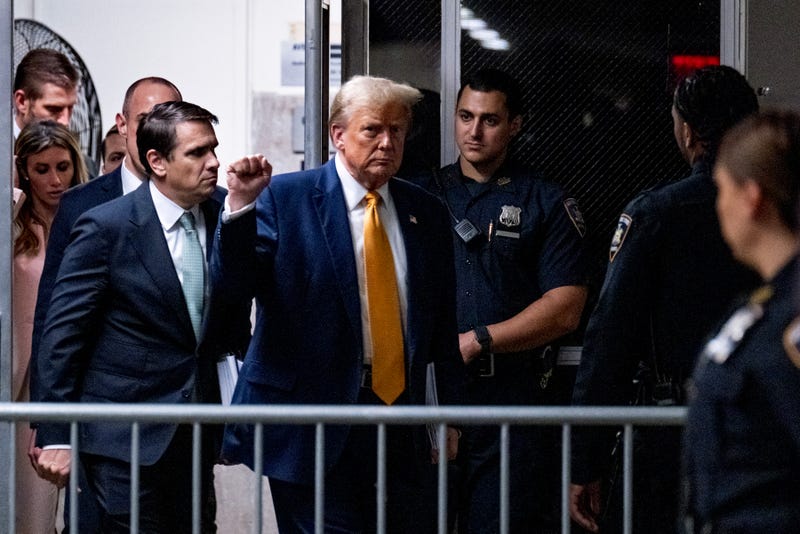 Former US President Donald Trump arrives for afternoon proceedings for his trial for allegedly covering up hush money payments linked to an extramarital affair with Stormy Daniels, at Manhattan Criminal Court on May 14, 2024 in New York City.