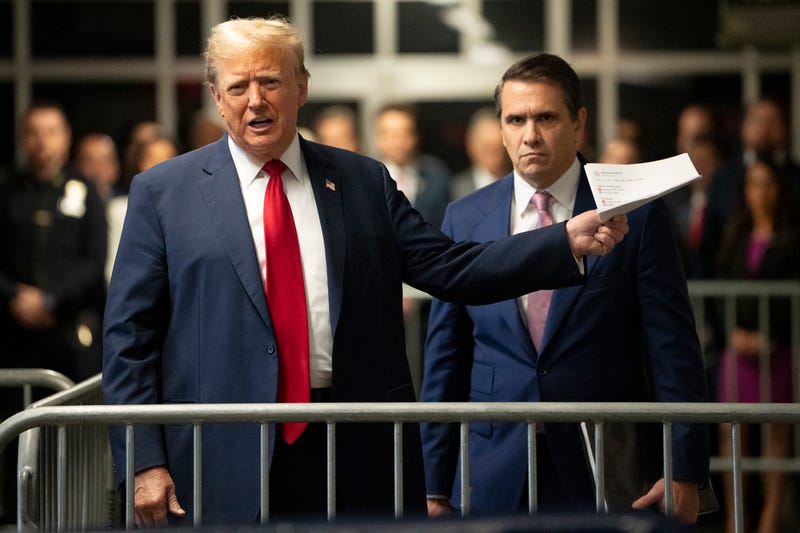 Former U.S. President Donald Trump with attorney Todd Blanche speaks to the media during his trial for allegedly covering up hush money payments at Manhattan Criminal Court on May 16, 2024 in New York City.