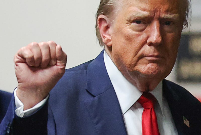 Former U.S. President Donald Trump gestures as he returns to court after a lunch break, during his trial for allegedly covering up hush money payments at Manhattan Criminal Court on May 16, 2024 in New York City.