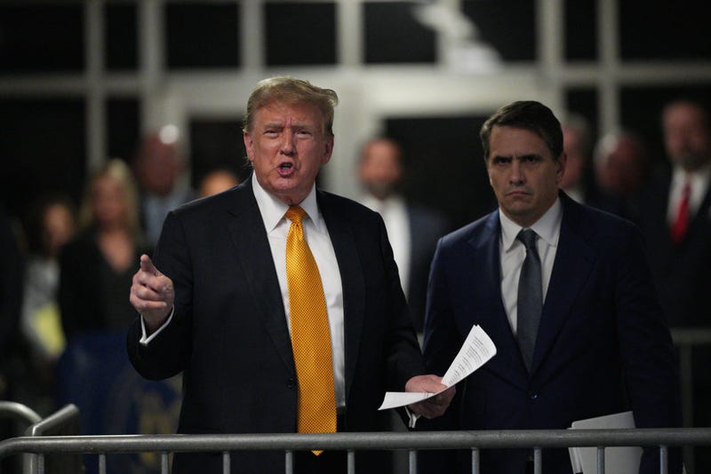 Former U.S. President Donald Trump with attorney Todd Blanche speaks to the media during his trial for allegedly covering up hush money payments at Manhattan Criminal Court on May 21, 2024 in New York City. 
