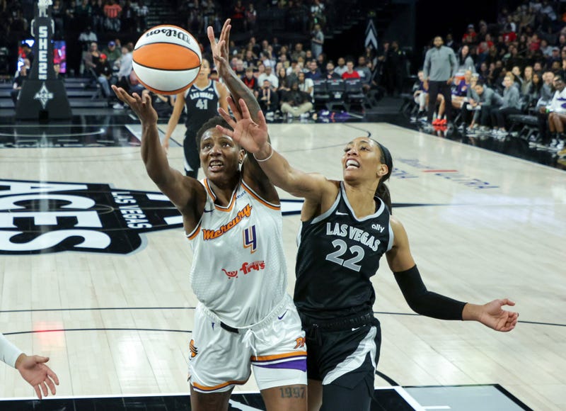  Natasha Mack #4 of the Phoenix Mercury grabs a rebound against A'ja Wilson #22 of the Las Vegas Aces in the first quarter of their game at Michelob ULTRA Arena on May 21, 2024 in Las Vegas, Nevada.