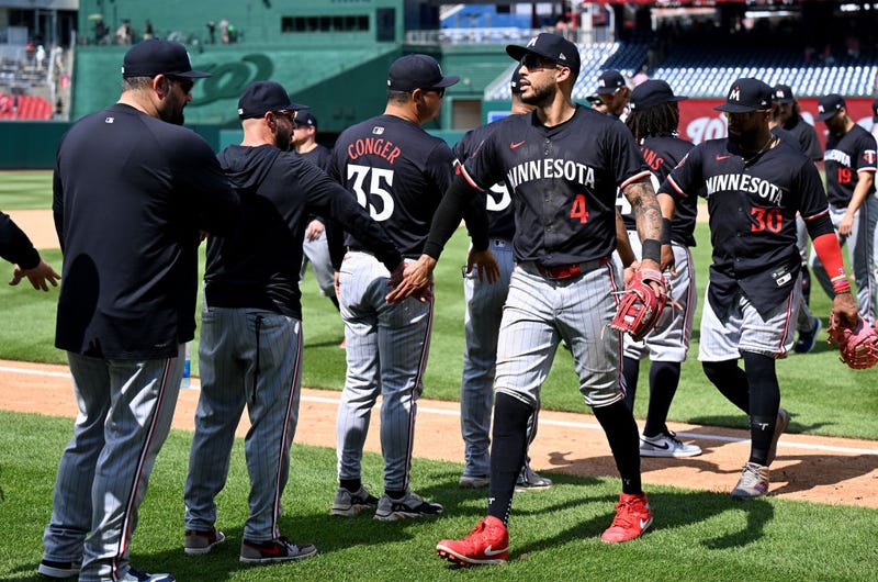 Carlos Correa #4 of the Minnesota Twins celebrates with teammates after a 3-2 victory against the Washington Nationals at Nationals Park on May 22, 2024 in Washington, DC.