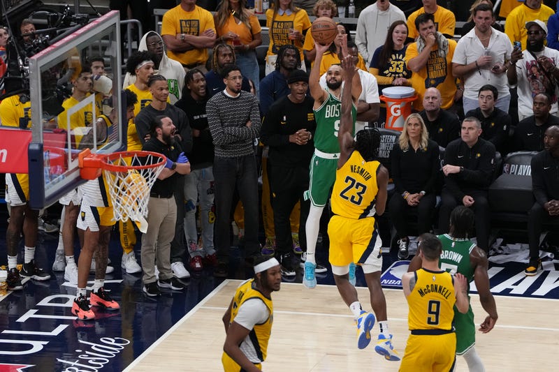Derrick White #9 of the Boston Celtics takes the game winning shot over Aaron Nesmith #23 of the Indiana Pacers during the fourth quarter in Game Four of the Eastern Conference Finals at Gainbridge Fieldhouse on May 27, 2024 in Indianapolis, Indiana.