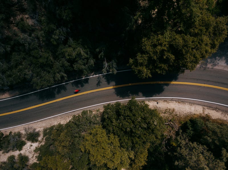 A cyclist heads down Angeles Crest Highway in California.