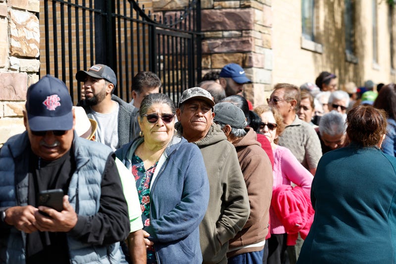 Mexican nationals wait to cast their vote