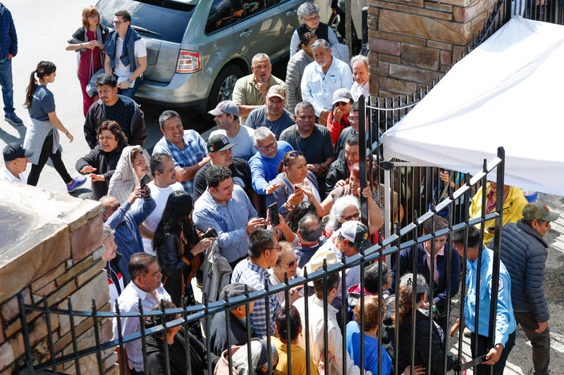 Mexican nationals wait to cast their vote