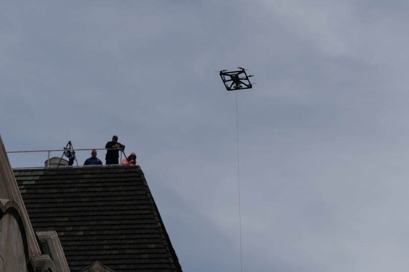 An NYPD drone and spotters on a roof are seen at the Israel Day on Fifth parade on June 2, 2024 in New York City. 