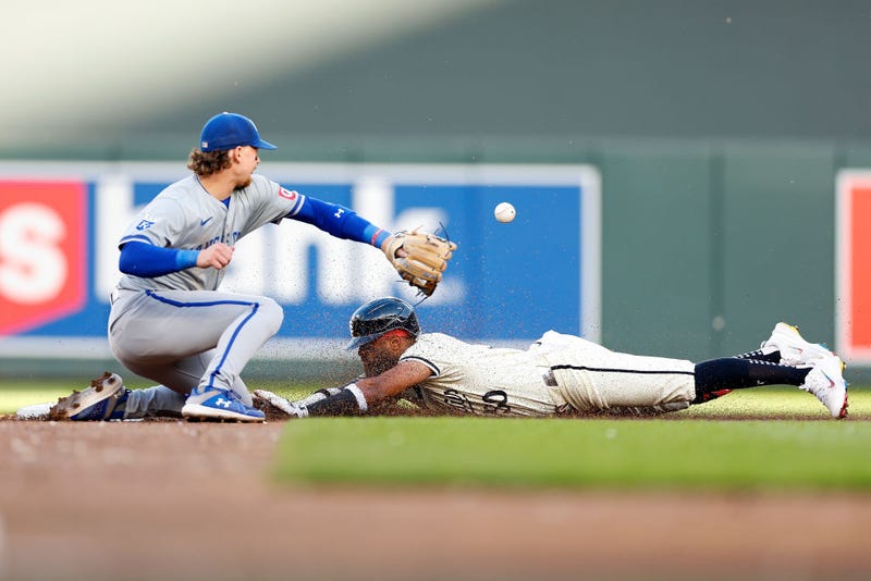 Willi Castro #50 of the Minnesota Twins slides into second base on his double as Bobby Witt Jr. #7 of the Kansas City Royals fields the ball in the second inning at Target Field on May 29, 2024 in Minneapolis, Minnesota.
