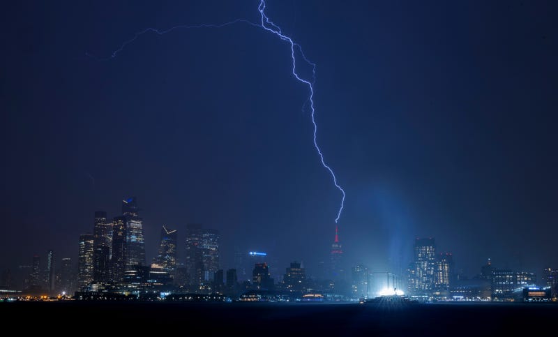 Lightning strikes the Empire State Building in New York City during a thunderstorm on May 29, 2024, as seen from Hoboken, New Jersey
