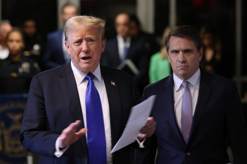 Former U.S. President Donald Trump, alongside his attorney Todd Blanche, speaks to the media as he arrives for his criminal trial for allegedly covering up hush money payments at Manhattan Criminal Court on May 30, 2024 in New York City. Judge Juan Merchan gave the jury their instructions, and deliberations are entering their second day. The former president faces 34 felony counts of falsifying business records in the first of his criminal cases to go to trial. 
