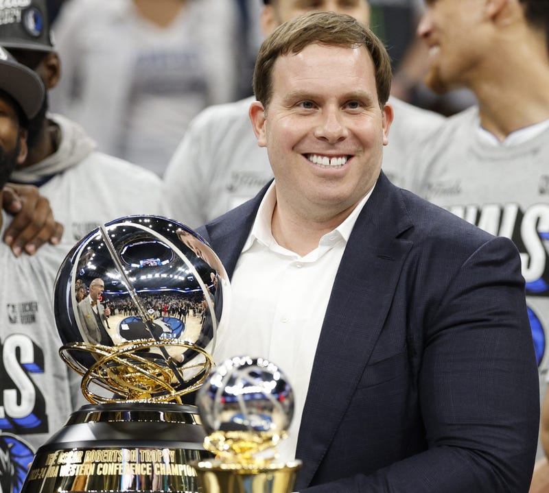 MINNEAPOLIS, MINNESOTA - MAY 30: Dallas Mavericks governor and majority shareholder Patrick Dumont celebrates with the Oscar Robertson Trophy after defeating the Minnesota Timberwolves in Game Five of the Western Conference Finals at Target Center on May 30, 2024 in Minneapolis, Minnesota. NOTE TO USER: User expressly acknowledges and agrees that, by downloading and or using this photograph, User is consenting to the terms and conditions of the Getty Images License Agreement. (Photo by David Berding/Getty Images)