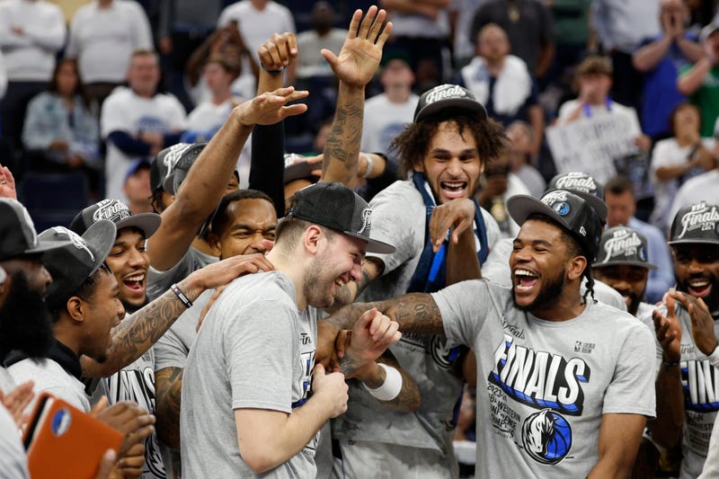 Luka Doncic #77 of the Dallas Mavericks celebrates with teammates after a 124-103 victory against the Minnesota Timberwolves in Game Five of the Western Conference Finals at Target Center on May 30, 2024 in Minneapolis, Minnesota.