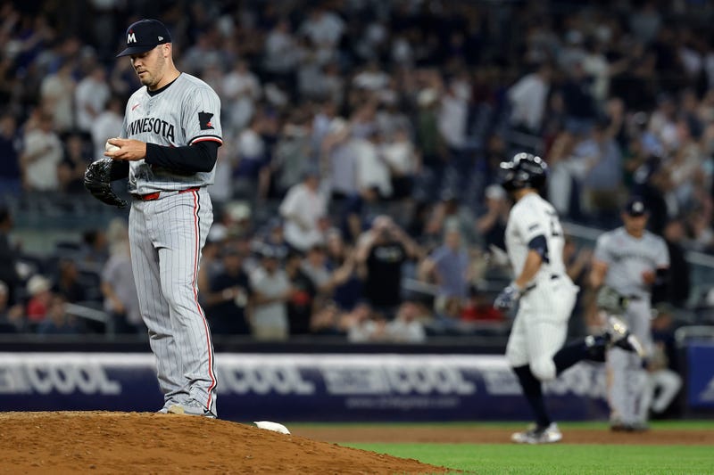 Caleb Thielbar #56 of the Minnesota Twins reacts after giving up a 2-run home run to Giancarlo Stanton #27 of the New York Yankees during the eighth inning at Yankee Stadium on June 4, 2024 in New York City. The Yankees won 5-1.