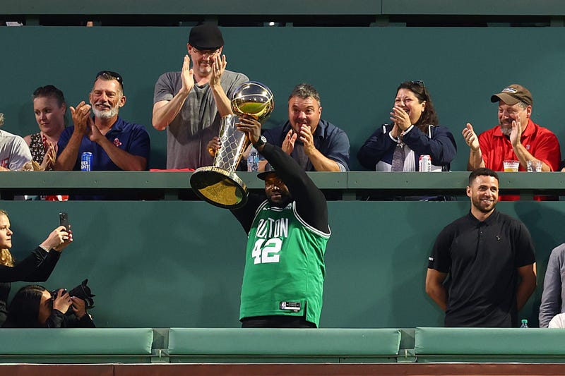 David Ortiz poses with the Larry O'Brien Championship Trophy during a game between the Atlanta Braves and Boston Red Sox at Fenway Park on June 04, 2024, in Boston, Massachusetts.