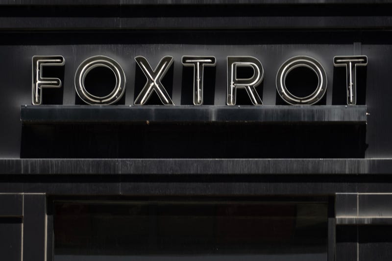 A sign hangs above a shuttered Foxtrot location on June 6, 2024, in Chicago. The grocery chain is set to reopen a location in the city's Gold Coast neighborhood in September.