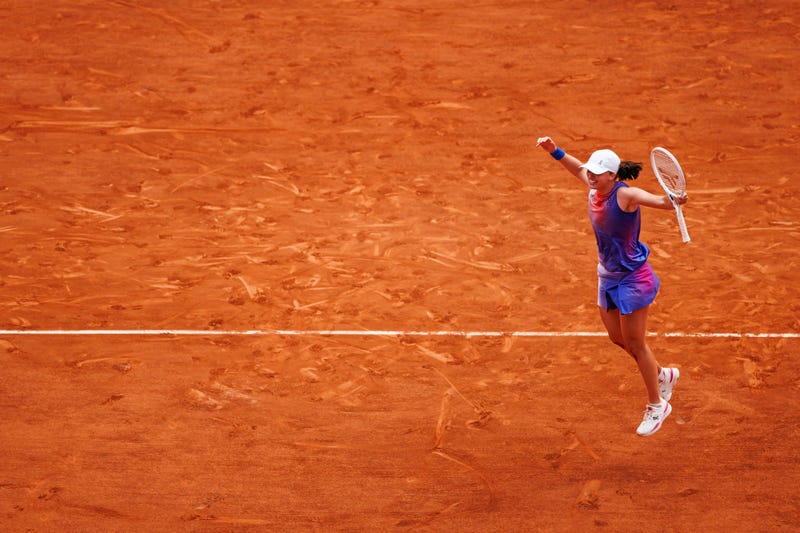 Iga Swiatek, of Poland, celebrates after beating Jasmine Paolini, of Italy, in the final of the women's singles at Roland Garros on June 8, 2024, in Paris, France.