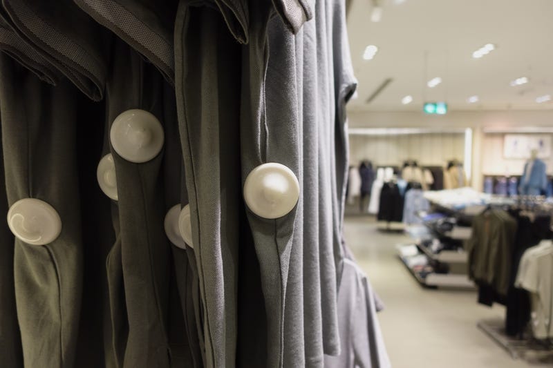 Clothing security tag on a shirt in retail store