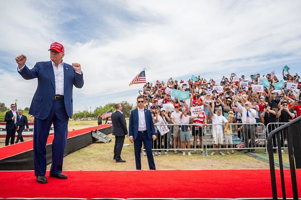 Republican presidential candidate, former U.S. President Donald Trump dances upon arrival at his campaign rally at Sunset Park on June 09, 2024 in Las Vegas, Nevada.