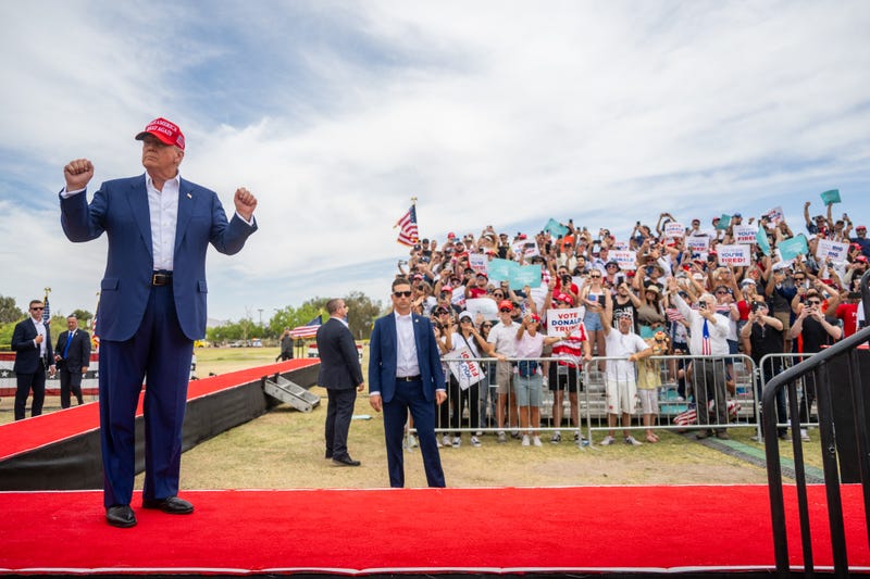 Republican presidential candidate, former U.S. President Donald Trump dances upon arrival at his campaign rally at Sunset Park on June 09, 2024 in Las Vegas, Nevada.