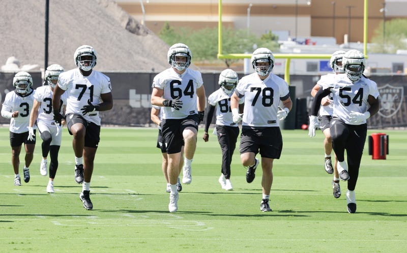 Offensive tackle DJ Glaze #71, guard Clark Barrington #64 and offensive tackles Dalton Wagner #78 and Jalen McKenzie #54 of the Las Vegas Raiders work out during mandatory minicamp at the Las Vegas Raiders Headquarters/Intermountain Healthcare Performance Center on June 11, 2024