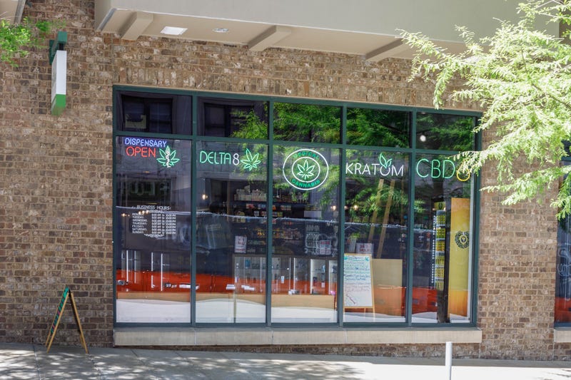 A dispensary displays signs for Delta-8 and other hemp-based products.
