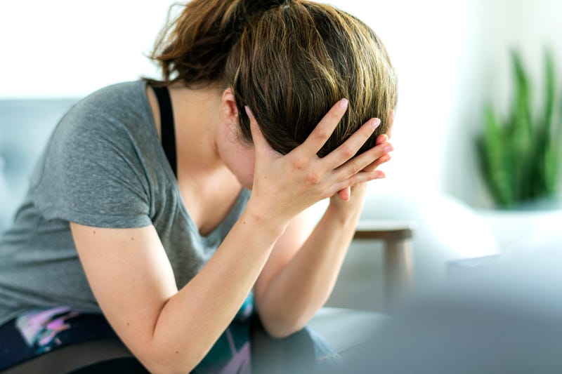 A stressed-out woman wonders what to do next