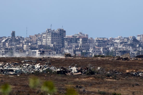 An Israeli army vehicle moves in the Gaza Strip as seen from a position on the Israeli side of the border on June 17, 2024 in Southern Israel, Israel.