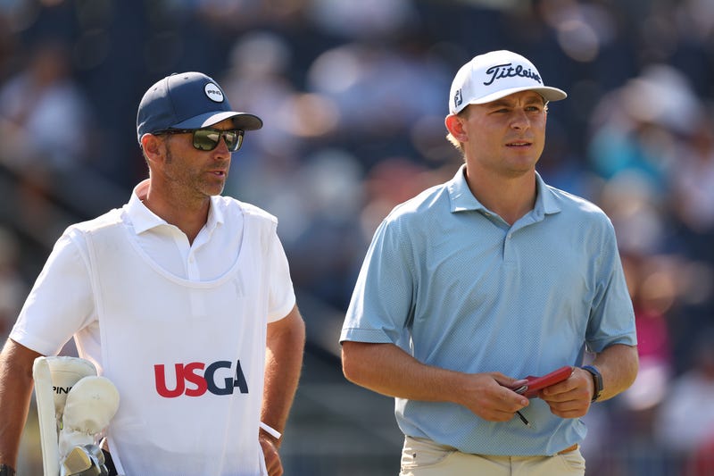 Amateur Gunnar Broin of the United States and his caddie, Chris Baisch, look on from the 13th tee during the second round of the 124th U.S. Open at Pinehurst Resort on June 14, 2024 in Pinehurst, North Carolina.