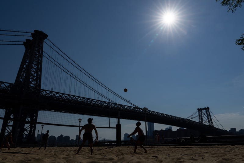 People play beach volleyball in Domino Park in Brooklyn