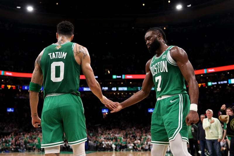 Jayson Tatum #0 high fives Jaylen Brown #7 of the Boston Celtics after a play against the Dallas Mavericks during the second quarter of Game Five of the 2024 NBA Finals at TD Garden on June 17, 2024 in Boston, Massachusetts.