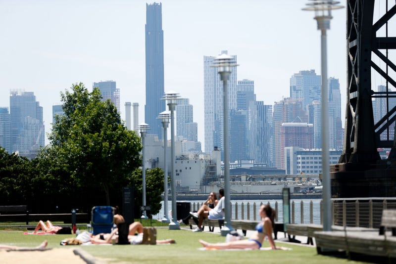 People sunbathe during a hot weather week in New York City on June 21, 2024.