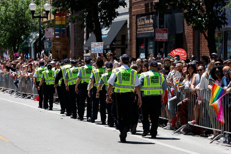 Chicago Police officers monitor the crowd during Pride Parade. 