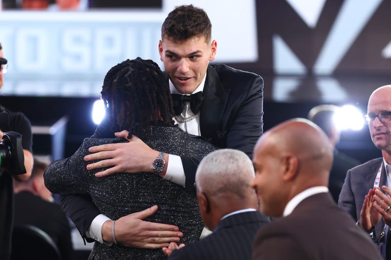 Stephon Castle celebrates with Donovan Clingan after being drafted fourth overall by the San Antonio Spurs during the first round of the 2024 NBA Draft at Barclays Center on June 26, 2024 in the Brooklyn borough of New York City.