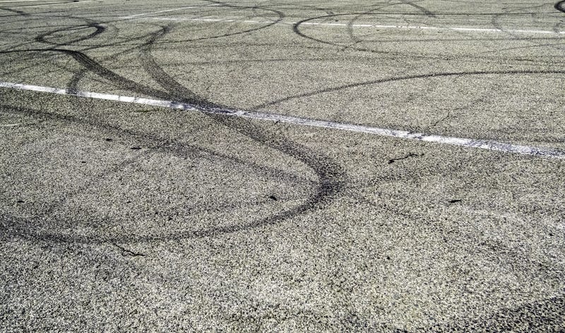 tire tracks on asphalt
