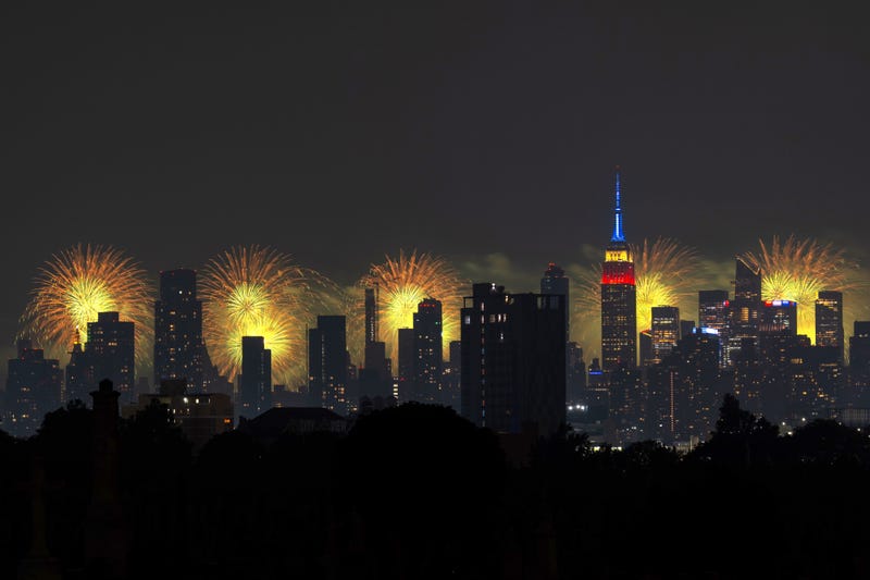 The Macy's 4th Of July fireworks show lights up the night sky as a backdrop to the Empire State Building on July 4, 2024