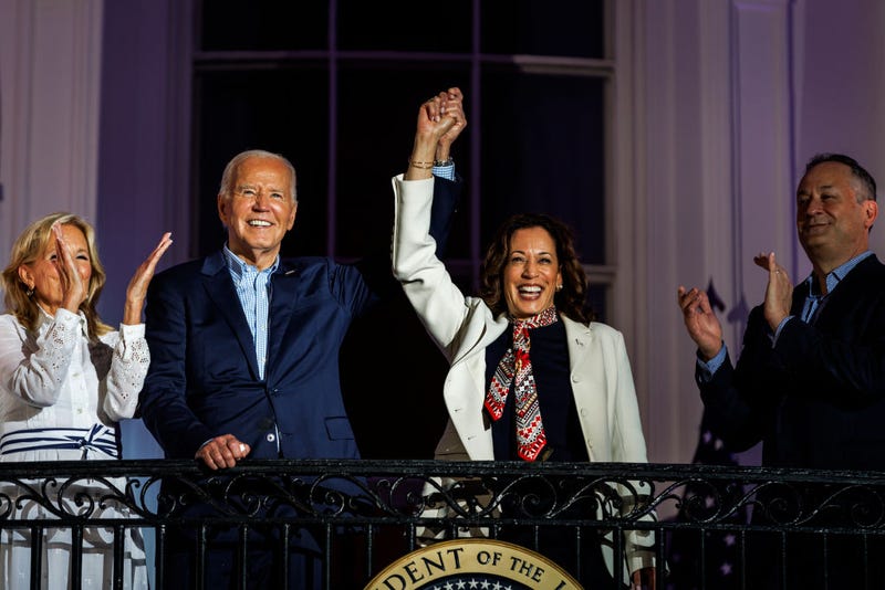 President Joe Biden and Vice President Kamala Harris join hands in the air as they view the fireworks on the National Mall on July 4, 2024. On Sunday, Biden officially ended his presidential campaign and endorsed Harris to be the Democratic Party's nominee.