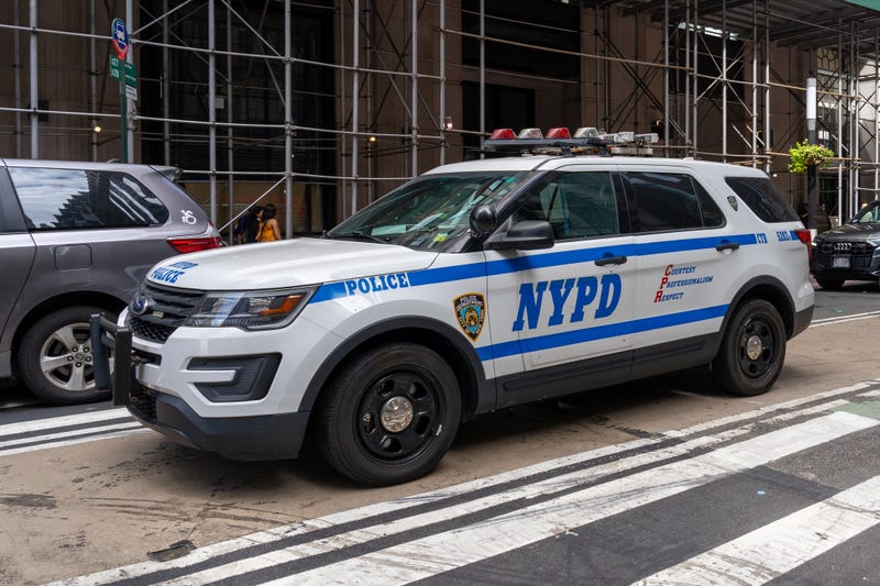 Two officers were suspended after leaving a scene of a fatal collision in upper Manhattan.