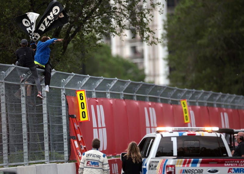 Protestors displaying a banner at Chicago NASCAR race